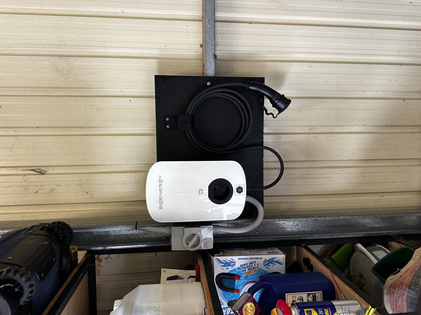 All Electrics Adelaide electrician with an EV charger
