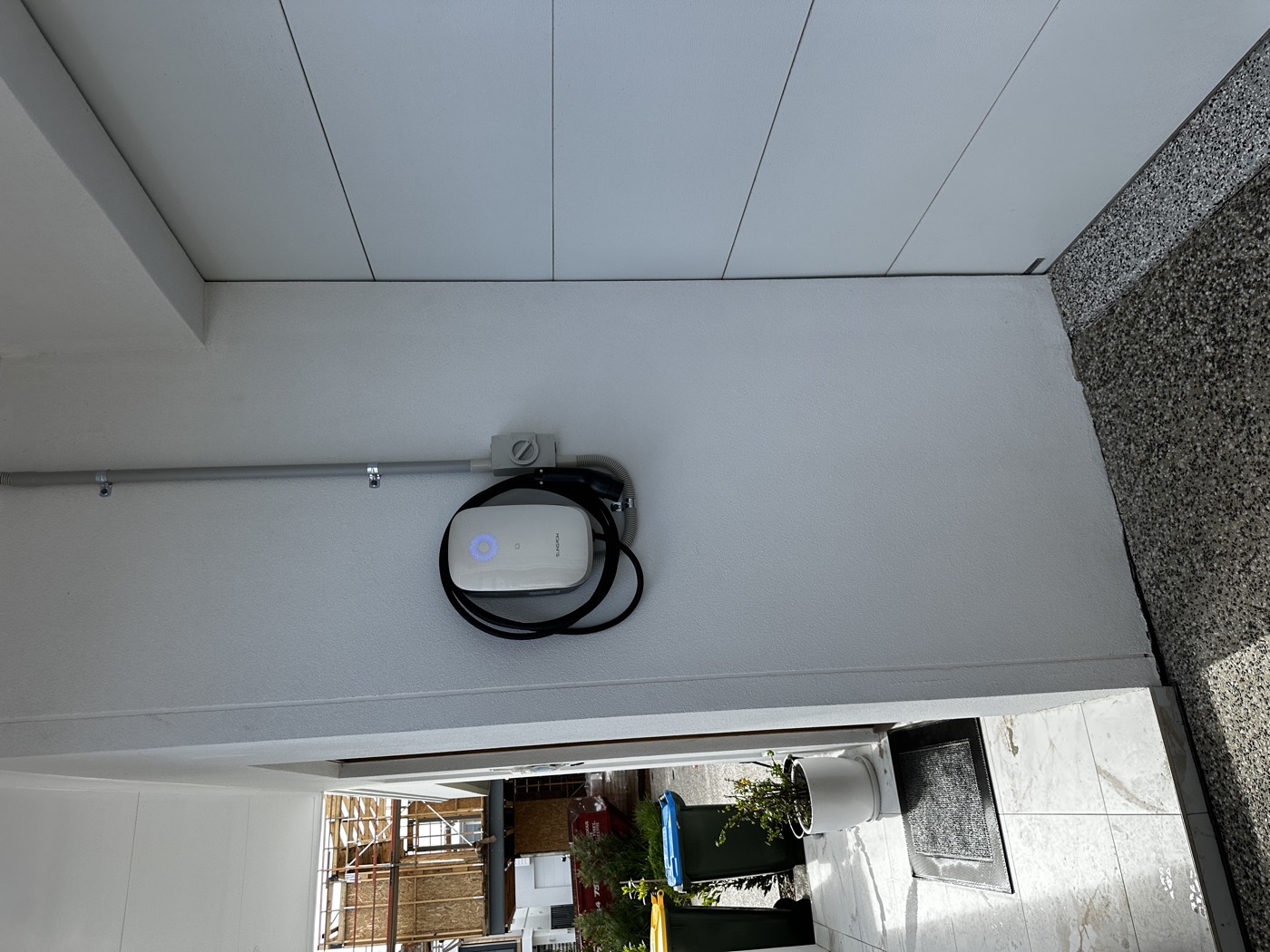 Outdoor EV charger installation on a home exterior